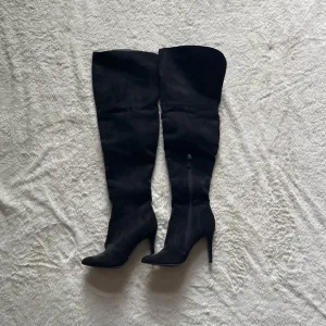 black thigh high boots