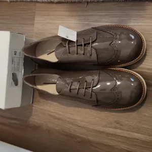 Brown patent leather dress shoes