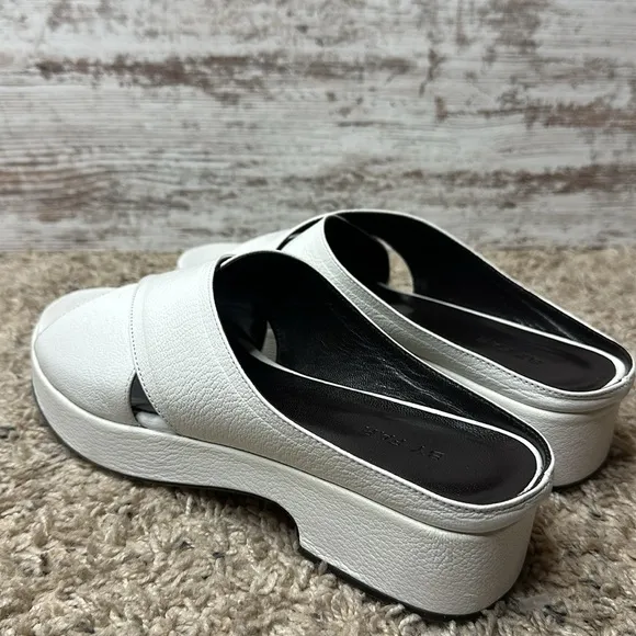 By Far Iggy Mules cross-front platform sandals in white leather