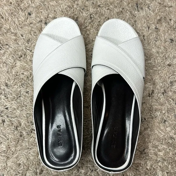By Far Iggy Mules cross-front platform sandals in white leather