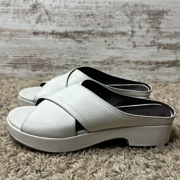 By Far Iggy Mules cross-front platform sandals in white leather
