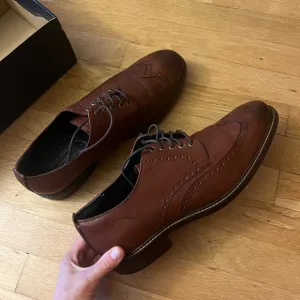 Cole Haan Men's Woodbury wingtip Dress Shoes, lined with warm material.
