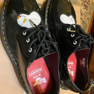 Dr. Martens Hello Kitty Black Patent Leather Black/White Platform Dress Shoes