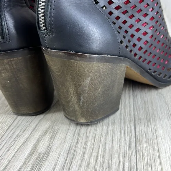 Kelsi Dagger black laser cut peep toe bootie.