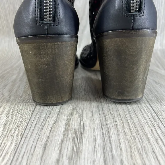 Kelsi Dagger black laser cut peep toe bootie.