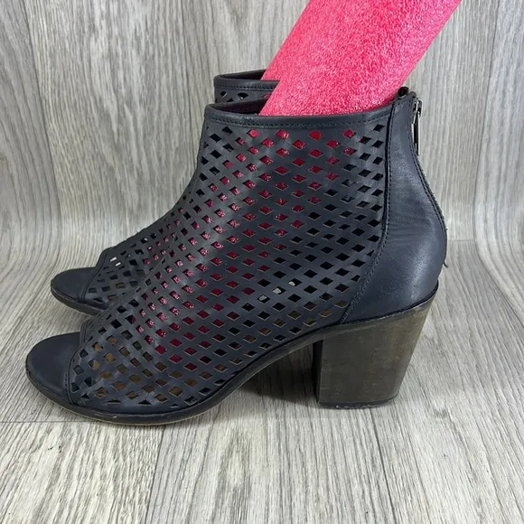 Kelsi Dagger black laser cut peep toe bootie.