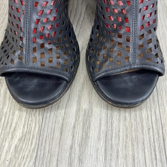 Kelsi Dagger black laser cut peep toe bootie.