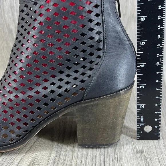 Kelsi Dagger black laser cut peep toe bootie.