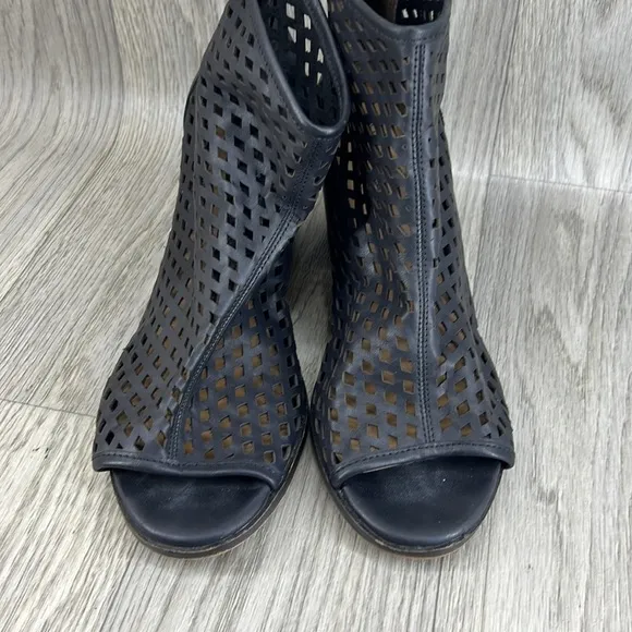Kelsi Dagger black laser cut peep toe bootie.