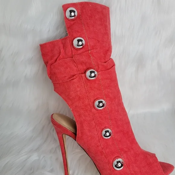Red boots stiletto heel open toe silver studs.