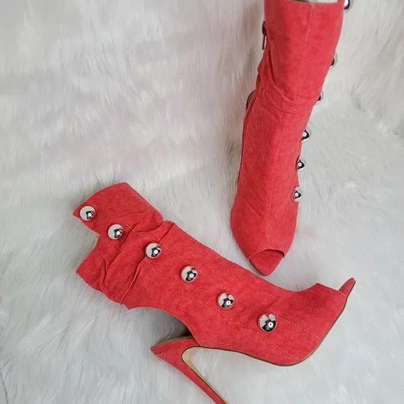 Red boots stiletto heel open toe silver studs.