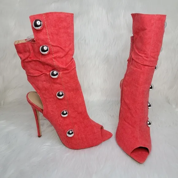 Red boots stiletto heel open toe silver studs.