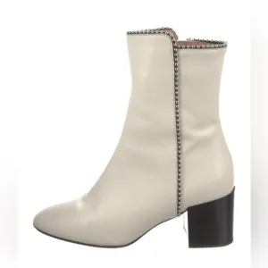 White with silver accents Aquatalia boots