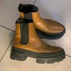Zara Tan Black rubberized bottom boots size 39